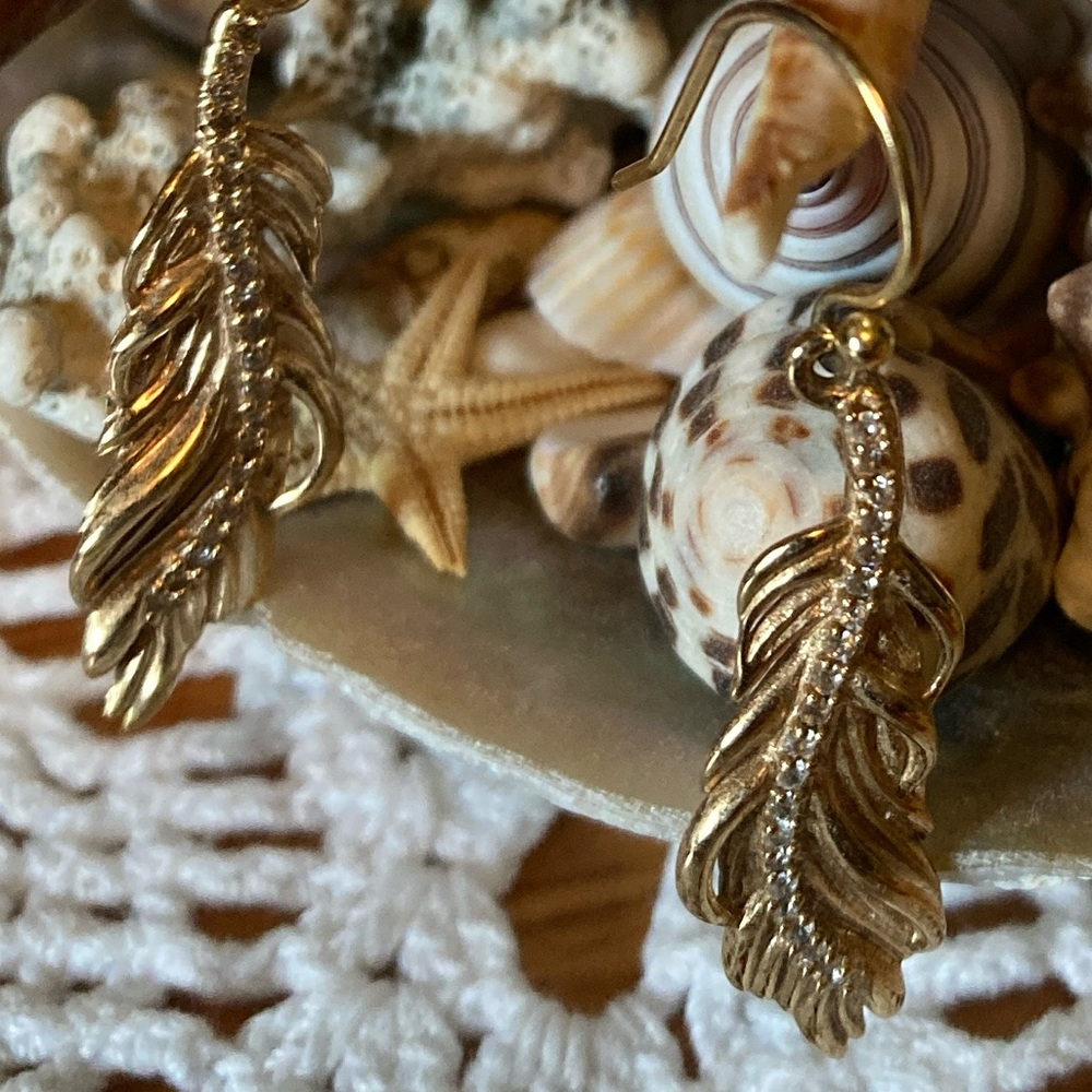 Earrings, Gold Feathers with faux crystals in the center, 1.25” Long